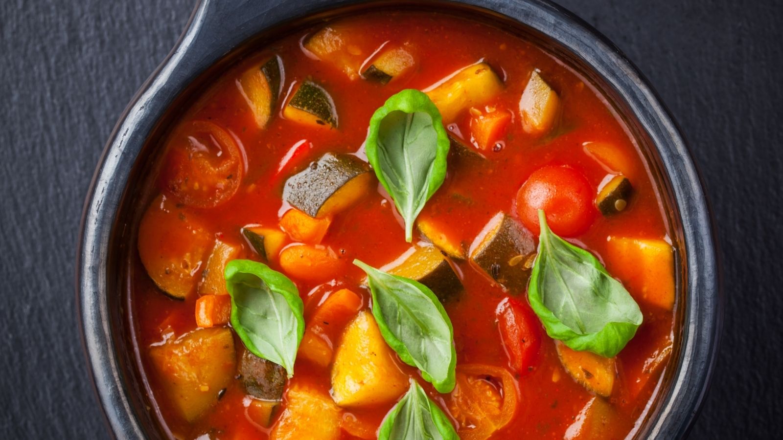 Summer minestrone soup recipe image of summer minestrone soup recipe with tomatoes and courgettes