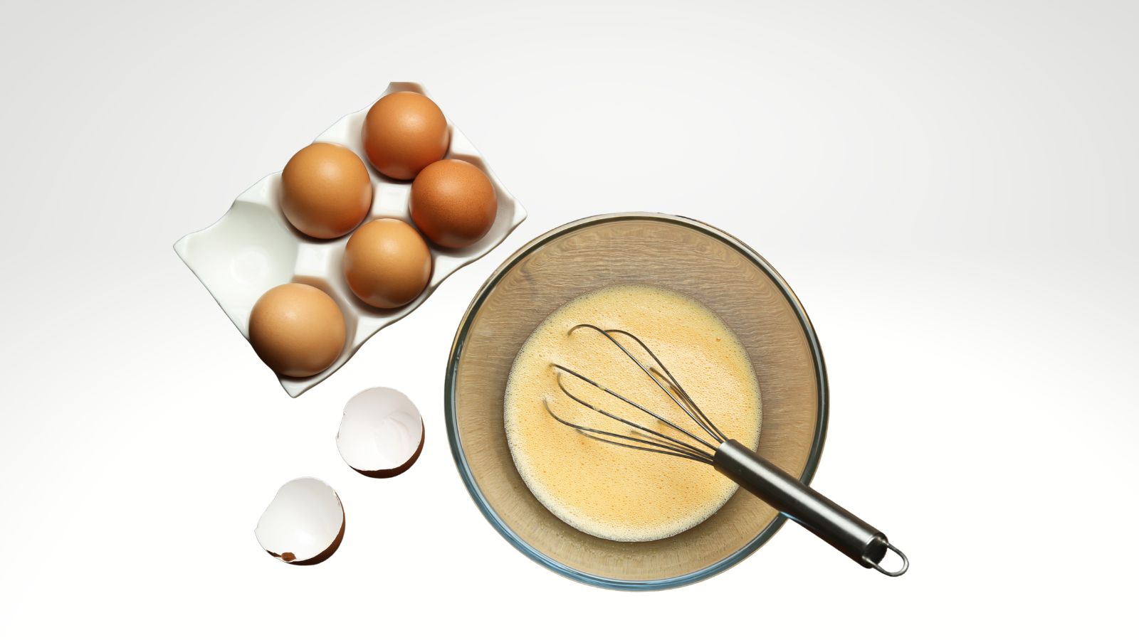 carbonara recipe beat eggs in a bowl image of eggs beaten in a bowl with a whisk and eggs in the backgrond