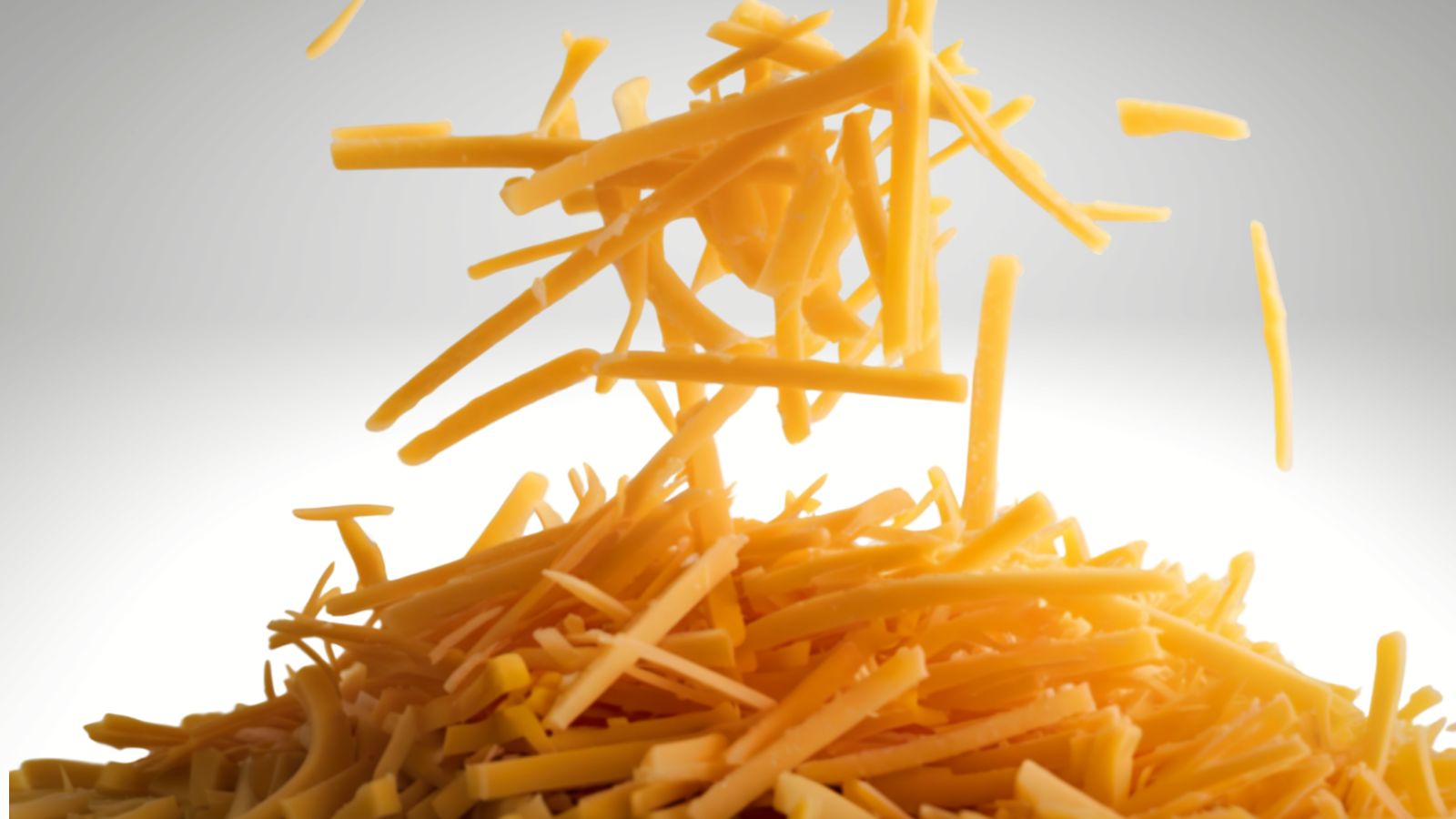 never buy bags of pre-grated cheese. image of pre-grated cheese