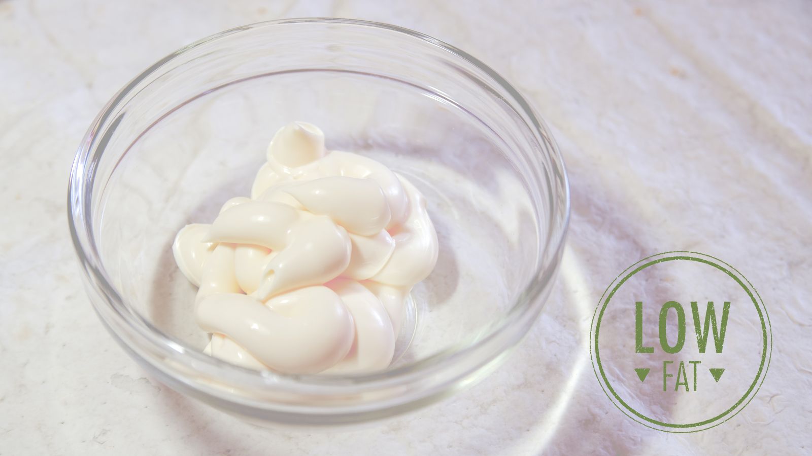 Never buy low fat mayo. image of a bowl of low fat mayo with low fat written as a logo in the far right hand corner