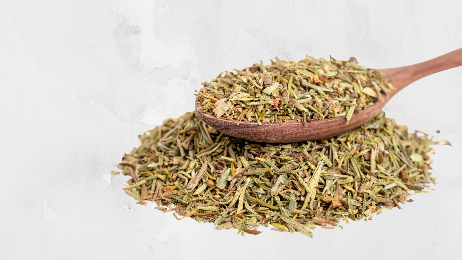 spice rack image of dried time on a spoon on top of dried thyme